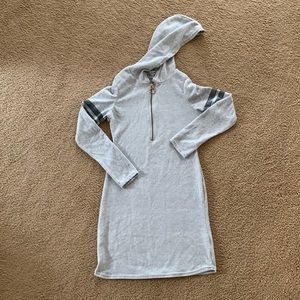 Gray hoodie dress with gold zipper and black strips on sleeves